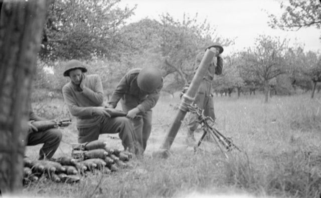 preparing to fire a 4.2in mortar