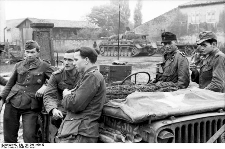 German soldiers with a captured american jeep