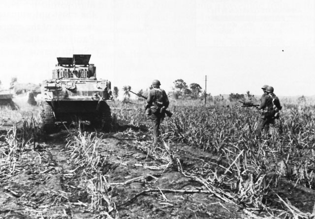 Advancing behind Tanks on Saipan