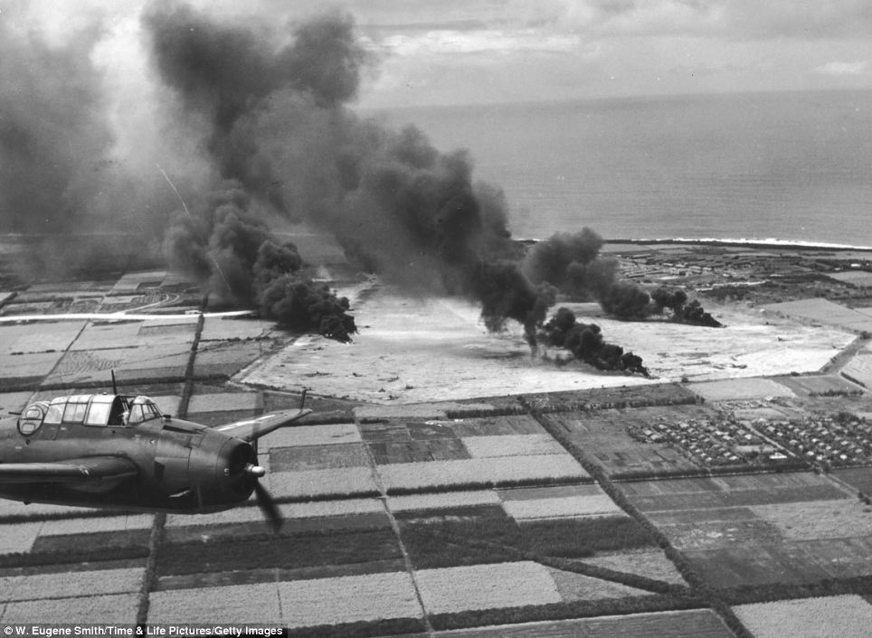 Grumman TBF-1 Avenger flies over fields