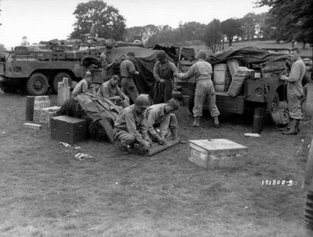 97th Evacuation Hospital men and vehicles