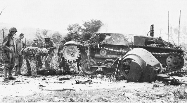 Inspecting a Destroyed Japanese Tank