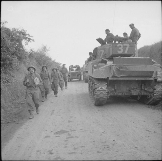 Infantry Pass Sherman Tanks