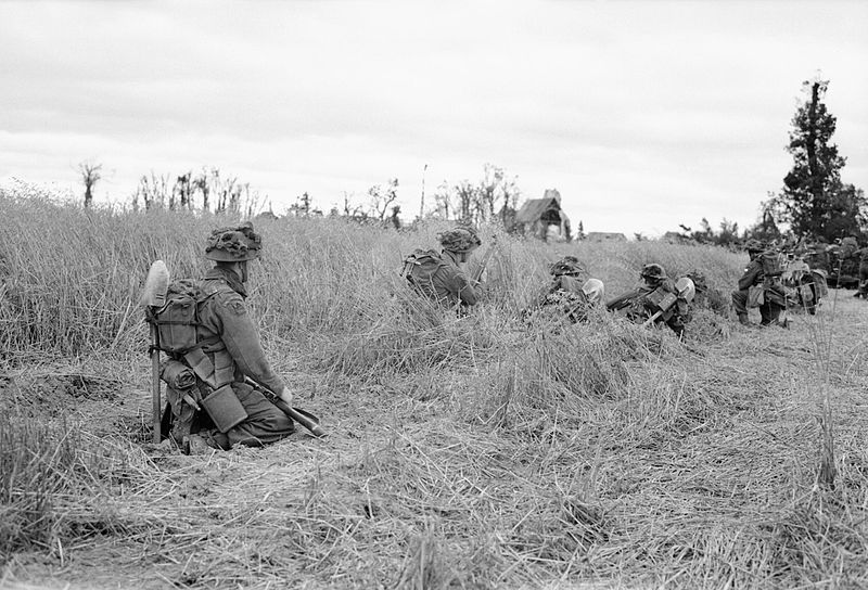 Men of the Lancashire Fusiliers crawl