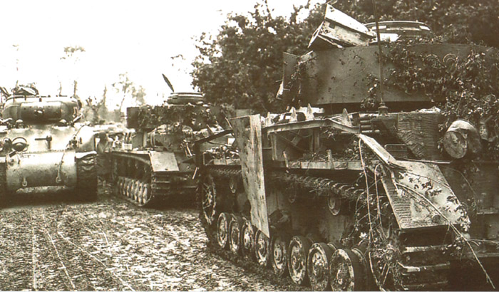 Sherman Tanks Moving Past <i<Panzer IVs</i>