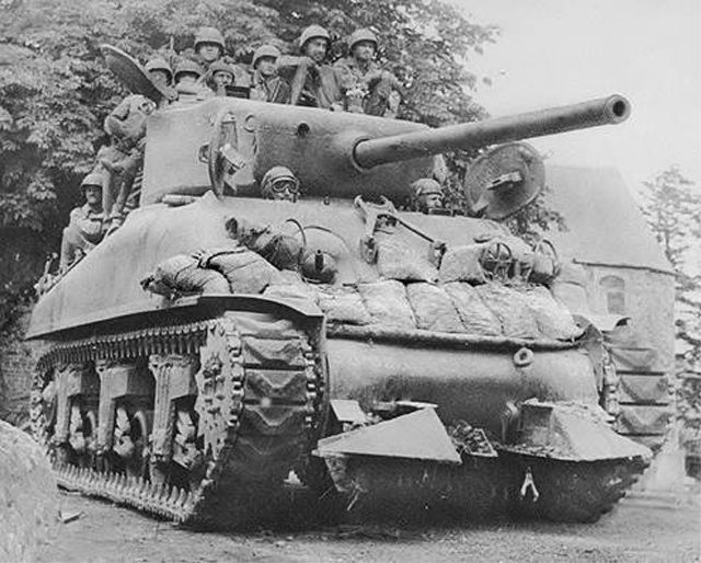 A Sherman tank equipped with the hedge cutter.