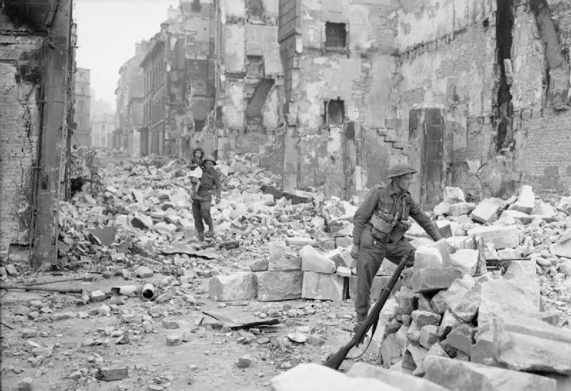 A British Soldier Carries a Little Girl