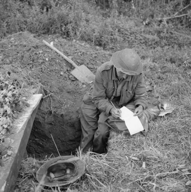 Writing Home from His Slit Trench