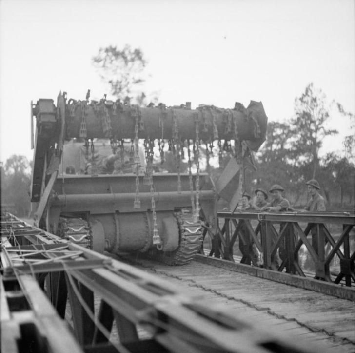 A Sherman Crab Flail Tank Crosses a Bailey Bridge