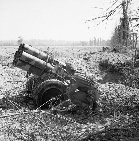 soldier examines an abandoned German 'Nebelwerfer'