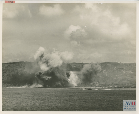 canopy of smoke rises from the shores of Guam