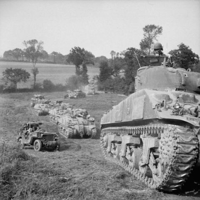 column of Sherman tanks