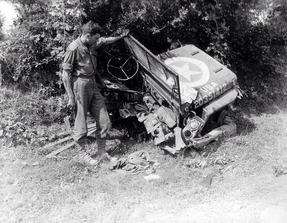 American soldier inspects a Jeep