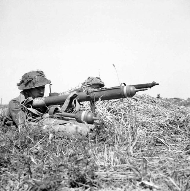 Prepares to fire a PIAT