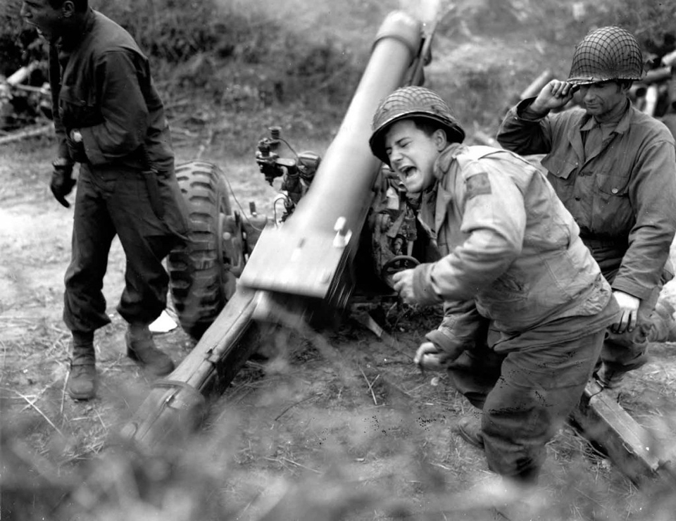 A US 105-mm M3 Howitzer In Action