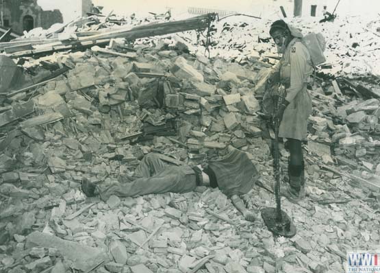 Indian soldier checking for mines