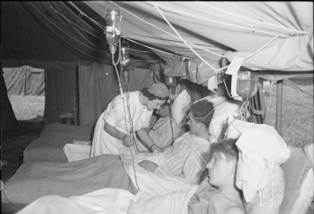 Nurse attends to wounded soldiers