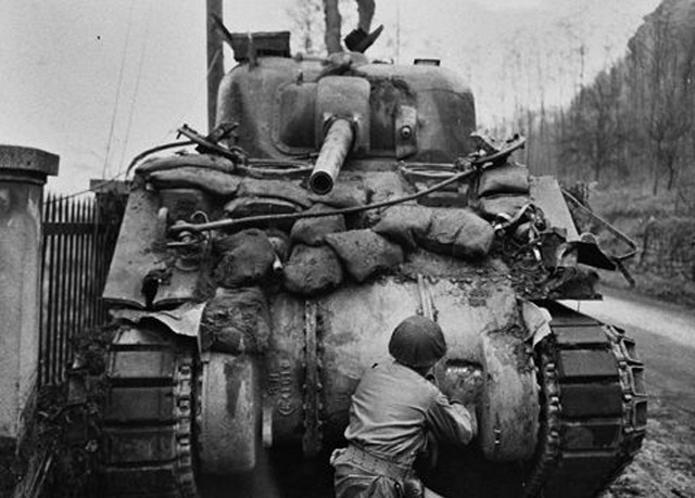 Assessing the Damage to an M4 Sherman