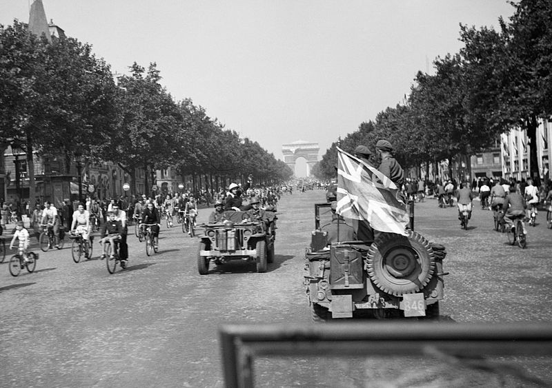 Drives Down the Champs Elysees in Paris