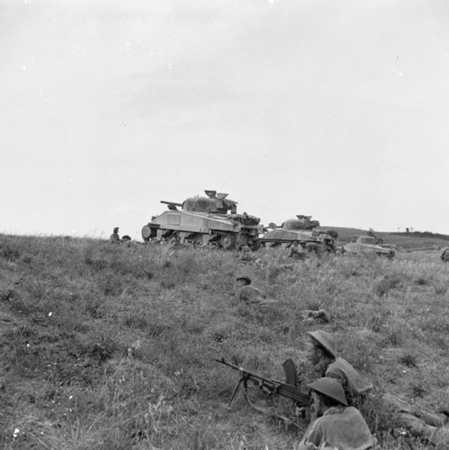 Sherman tanks supporting infantry