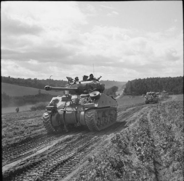 column of Sherman tanks