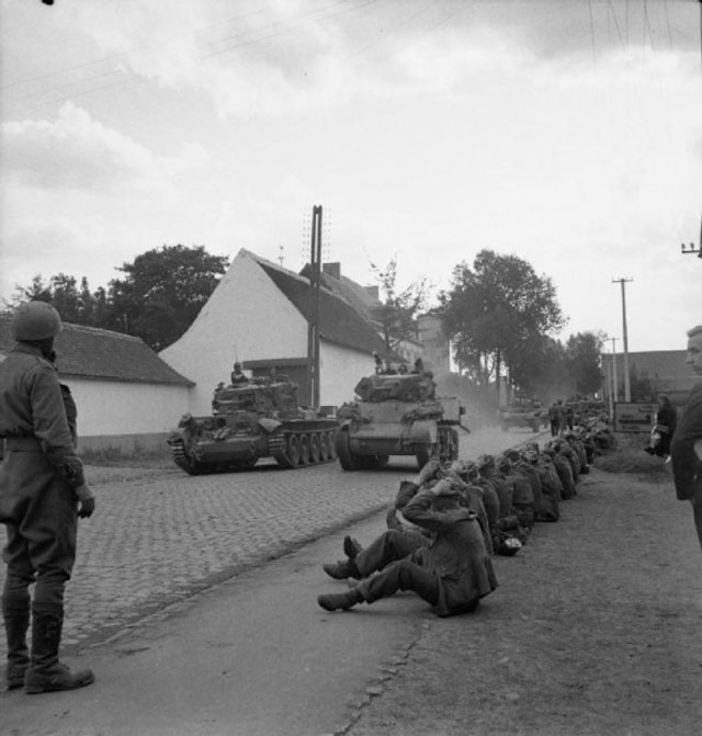 Tanks Passing German POWs