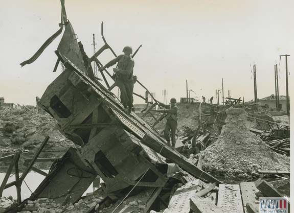 US Soldiers Crossing Destroyed Bridge