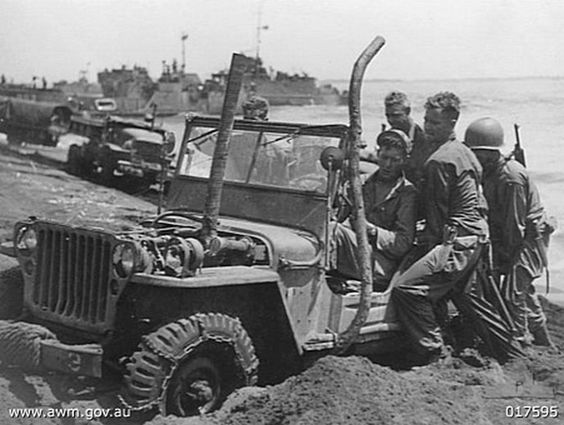 US Soldiers Pushing Jeep