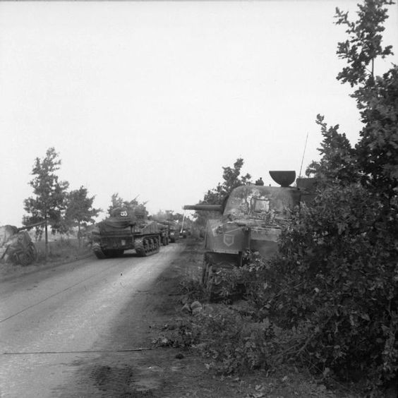 Irish Guards Sherman tanks advance