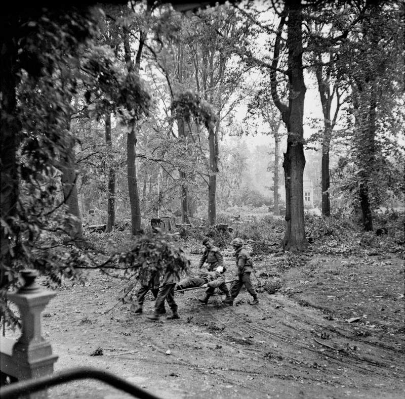 Wounded Man Being Carried Away