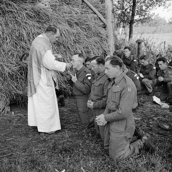 Father C V Murphy carries out Mass