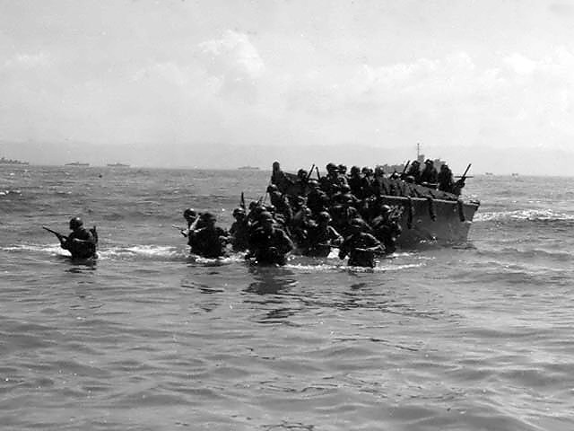 unload men and equipment on beachhead