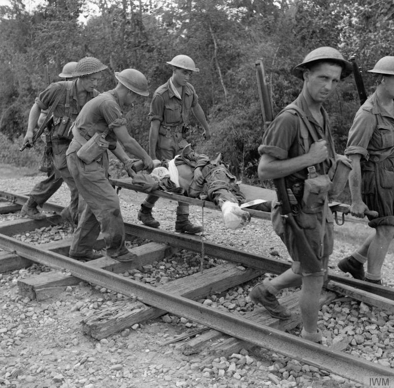 Wounded Prisoner Carried on a Stretcher