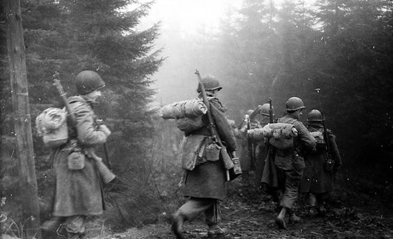 US 101st Airborne Infantry Division Moves through Bastogne