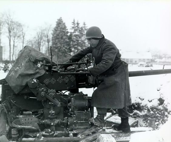 Cleaning a 40-mm Anti-aircraft Gun