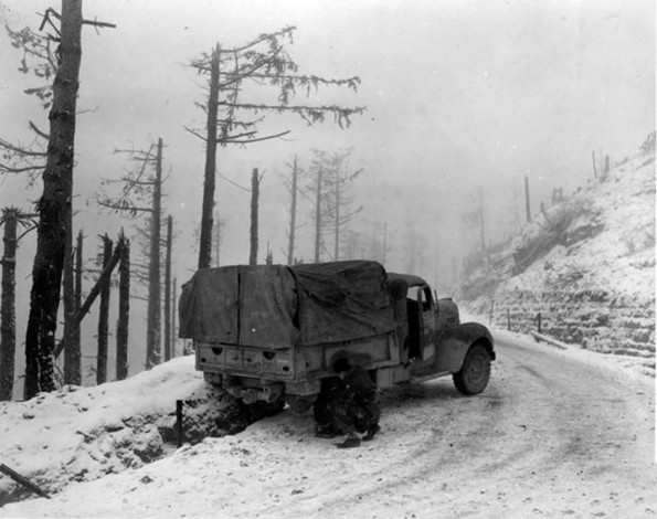 putting chains on his trucks tires