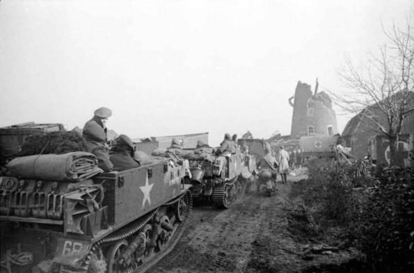 Vehicles near a Ruined Windmill