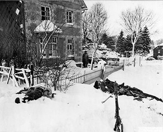 Dead German soldiers lie in the snow