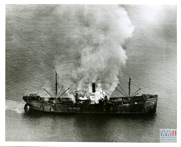 Freighter set afire by the strafing of Fighter Planes