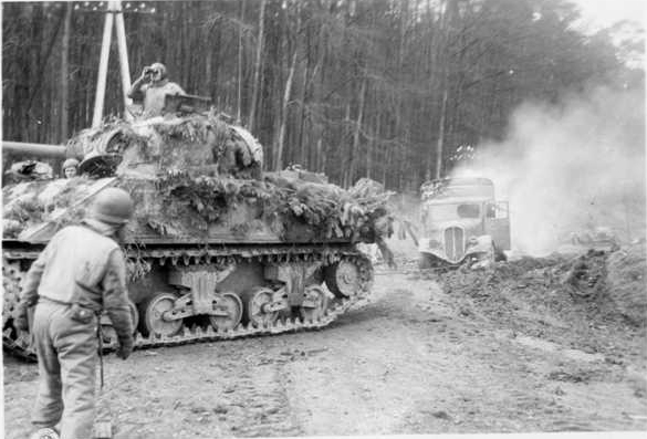 Clearing the Road of Burning German Vehicles