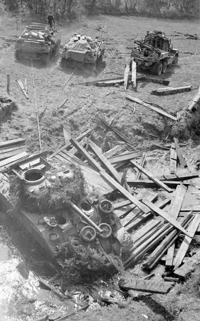 Recovery Vehicles Prepare To Tow a Sherman