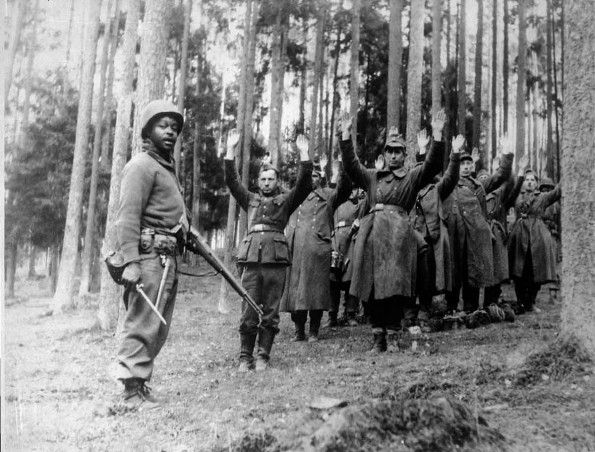 12th Armored Division Soldier with German POWs