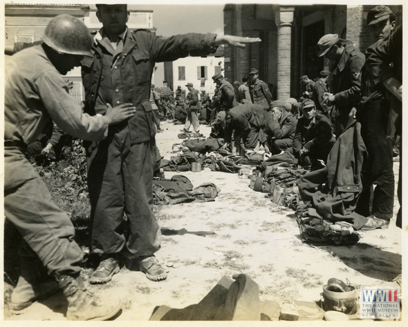 German POWs wait to be searched