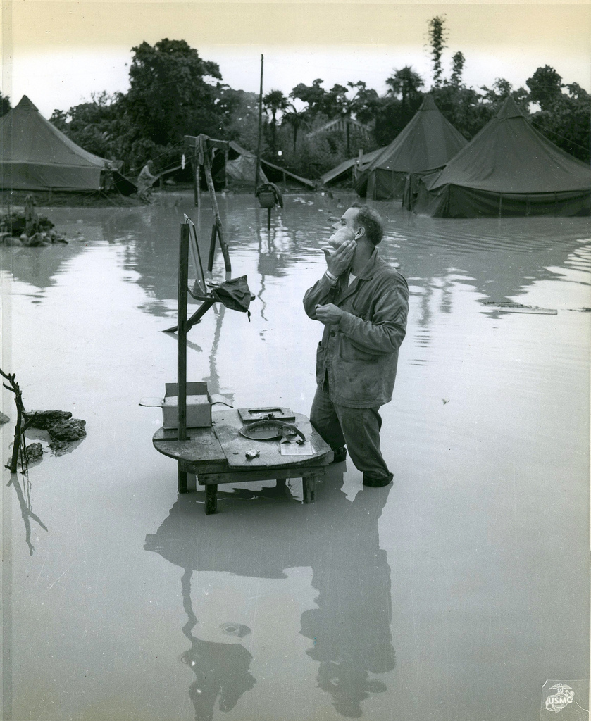 Shaving in a Flooded Camp