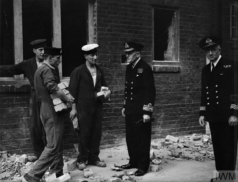 Inspecting Sailors Repairing Houses