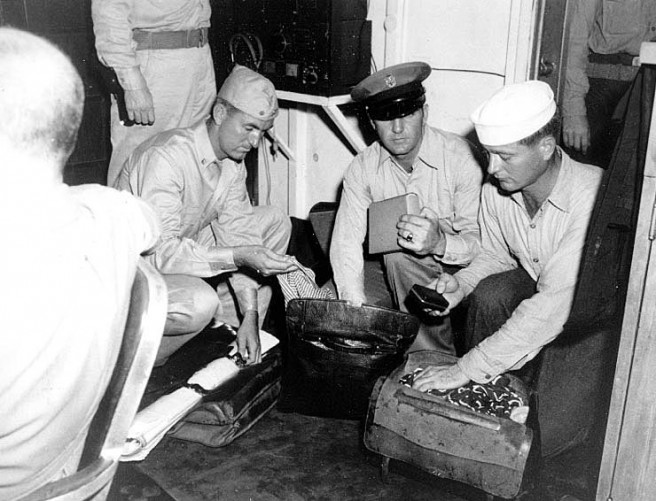 Japanese officers briefcases are searched